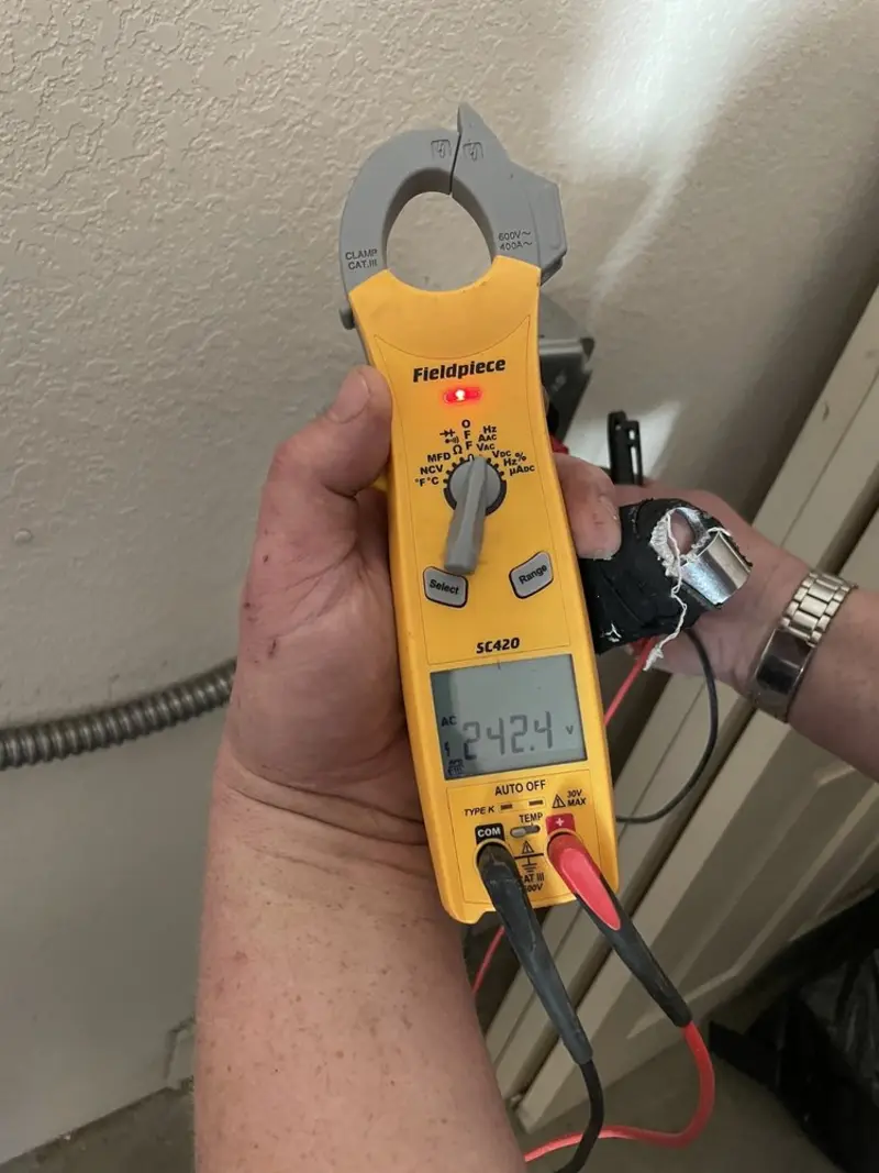Voltage testing with clamp meter during Electrical Installation Services in Pomfret